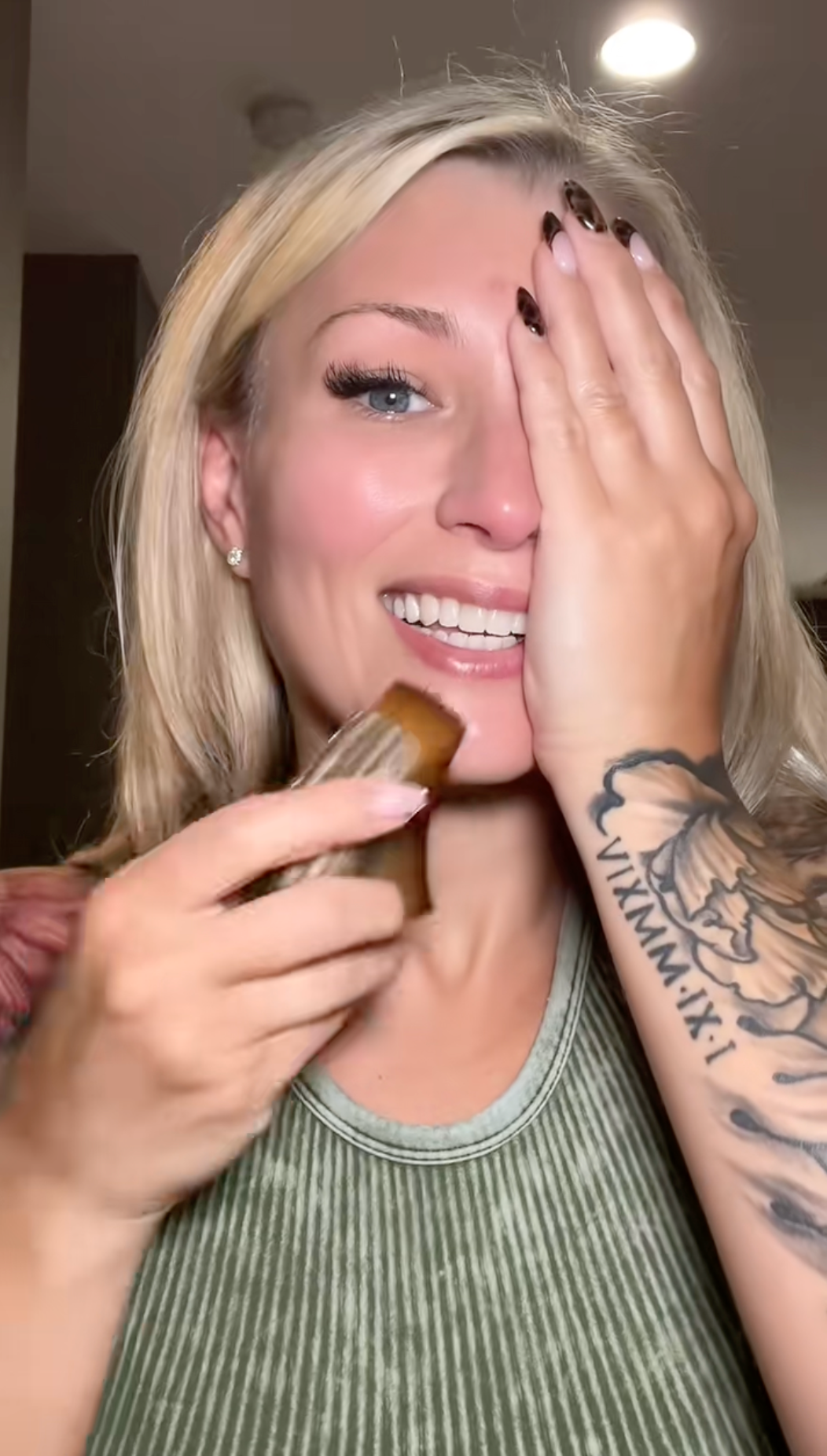 Customer using the Kojeva lymphatic face brush